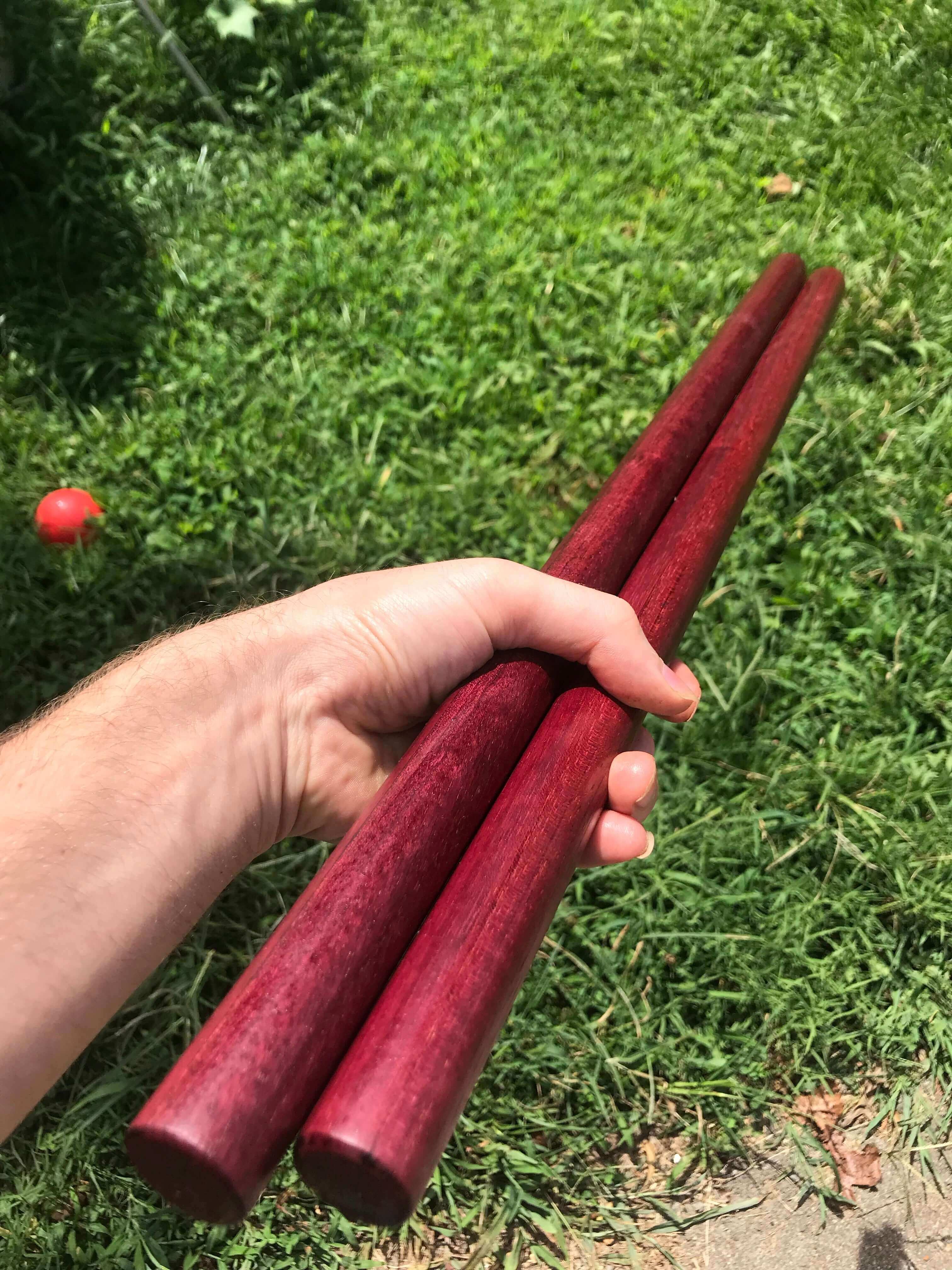 Holding escrima Shortstaffs outside.