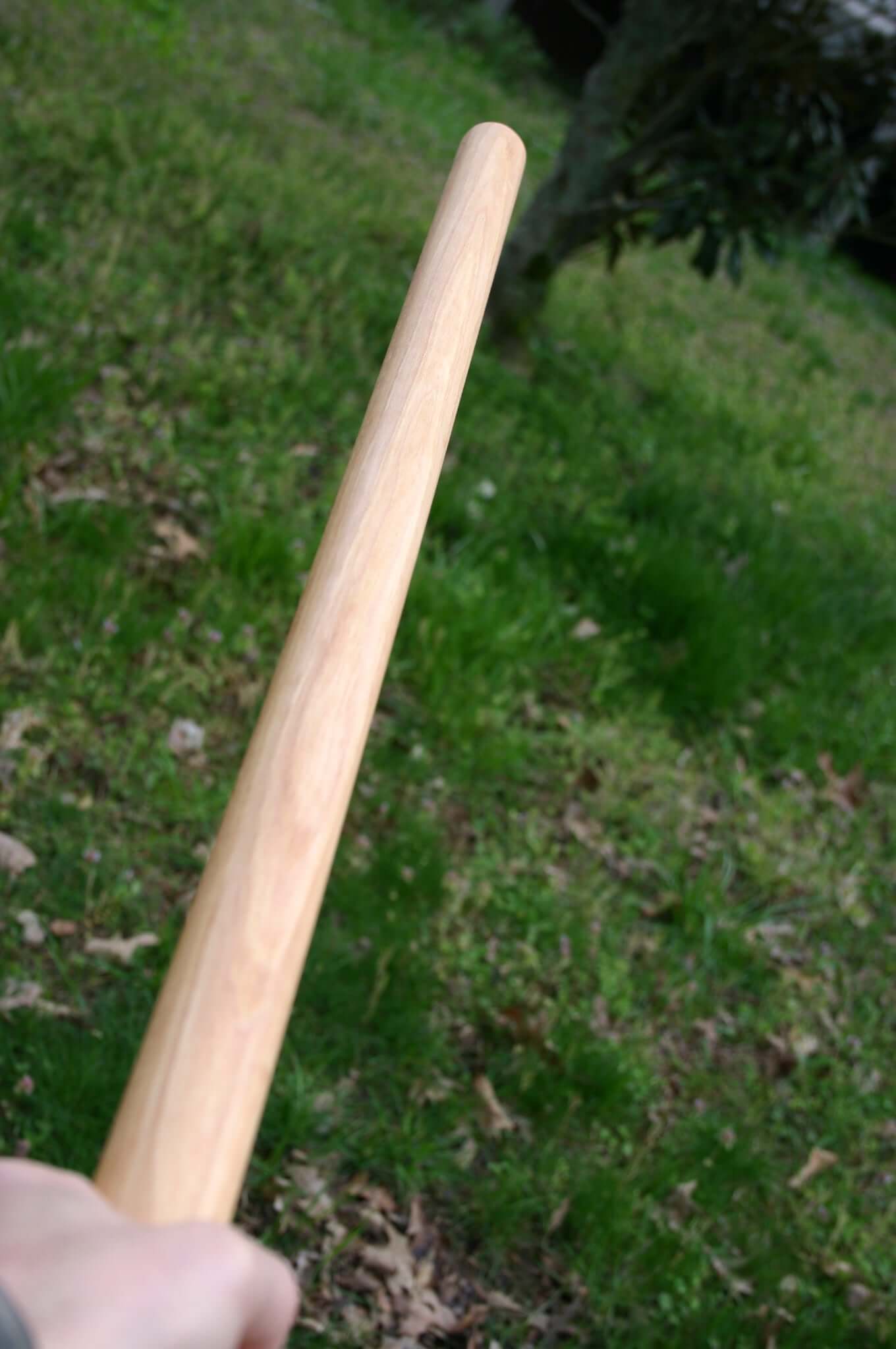 Holding a Hickory Handmade Tanbo Stick.